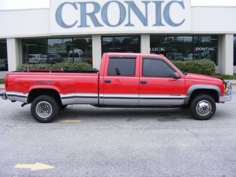 Victory Red GMC Sierra 3500 SLE Crew Cab 4x4 Dually.  Click to enlarge.