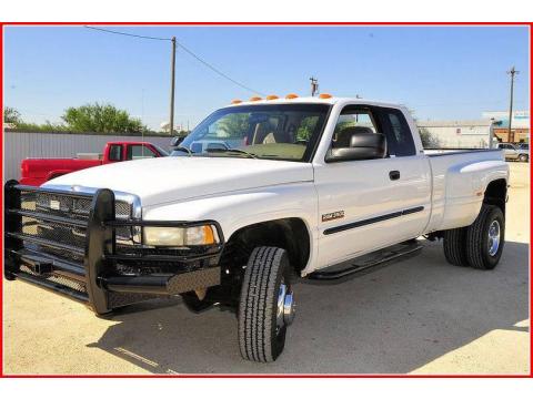 Bright White Dodge Ram 3500 SLT Quad Cab 4x4 Dually.  Click to enlarge.