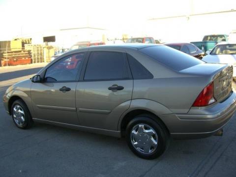 Arizona Beige Metallic Ford Focus SE Sedan.  Click to enlarge.