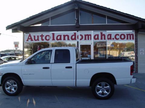 Bright White Dodge Ram 1500 SLT Quad Cab 4x4.  Click to enlarge.