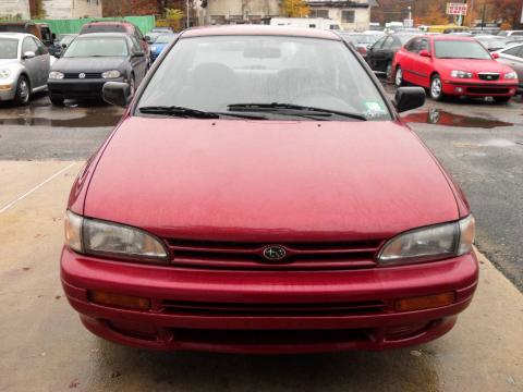 Crimson Pearl Metallic Subaru Impreza L Sedan.  Click to enlarge.