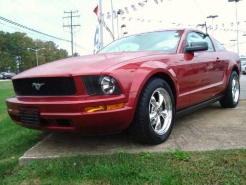 Redfire Metallic Ford Mustang V6 Deluxe Coupe.  Click to enlarge.