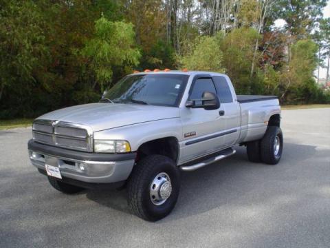 Bright Silver Metallic Dodge Ram 3500 SLT Quad Cab 4x4 Dually.  Click to enlarge.