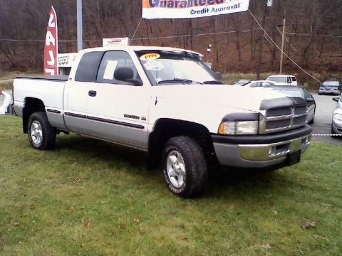 Bright White Dodge Ram 1500 SLT Extended Cab 4x4.  Click to enlarge.