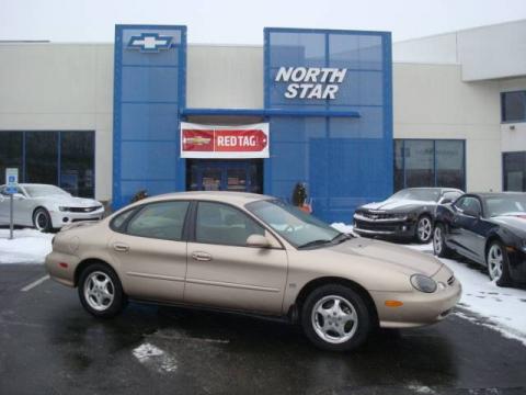 Light Prairie Tan Metallic Ford Taurus SE.  Click to enlarge.