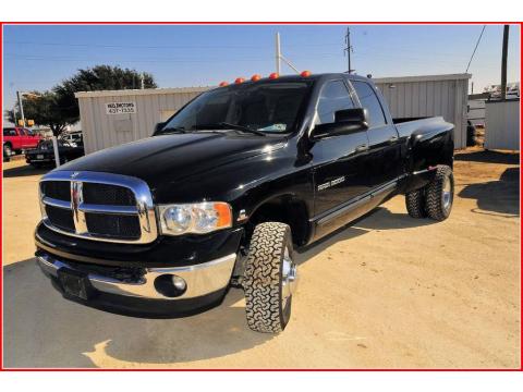 Black Dodge Ram 3500 SLT Quad Cab 4x4 Dually.  Click to enlarge.
