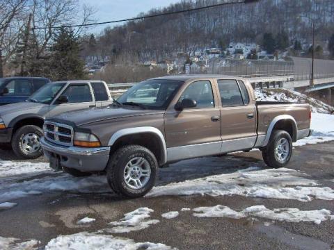 Light Almond Pearl Dodge Dakota SLT Quad Cab 4x4.  Click to enlarge.