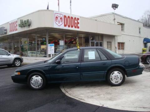 Dark Teal Metallic Oldsmobile Cutlass Supreme SL Sedan.  Click to enlarge.