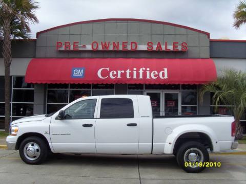 Bright White Dodge Ram 3500 SLT Mega Cab Dually.  Click to enlarge.