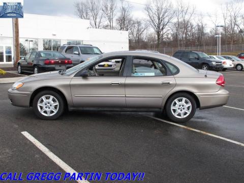 Arizona Beige Metallic Ford Taurus SE.  Click to enlarge.