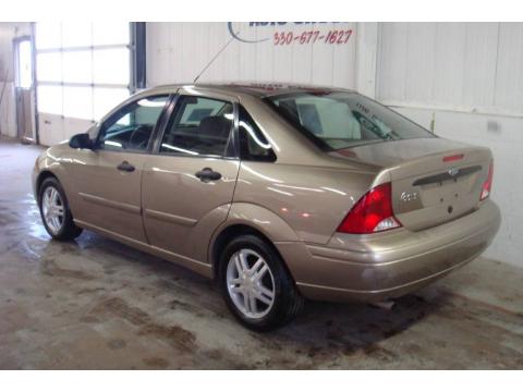 Arizona Beige Metallic Ford Focus SE Sedan.  Click to enlarge.