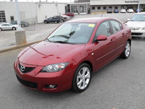 Copper Red Mica Mazda MAZDA3 i Touring Sedan.  Click to enlarge.