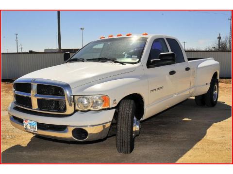 Bright White Dodge Ram 3500 SLT Quad Cab 4x4 Dually.  Click to enlarge.