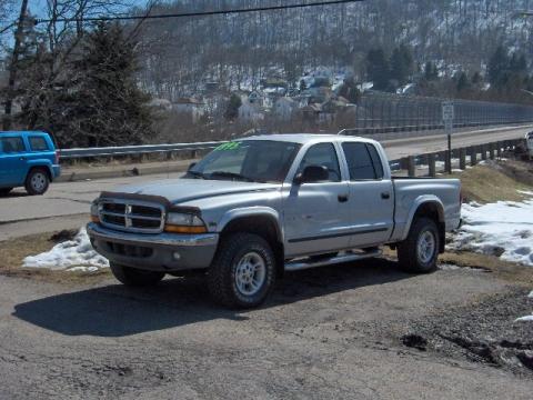 Bright Silver Metallic Dodge Dakota SLT Quad Cab 4x4.  Click to enlarge.