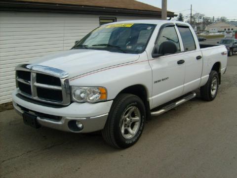 Bright White Dodge Ram 1500 SLT Quad Cab 4x4.  Click to enlarge.