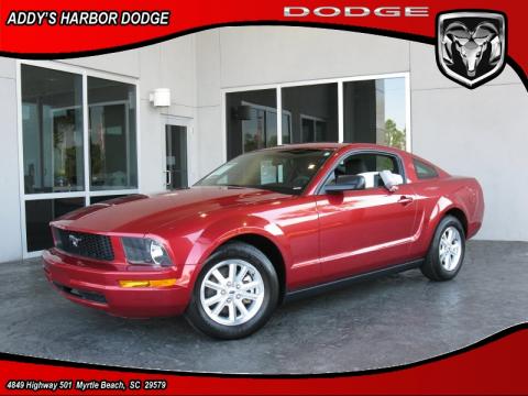 Redfire Metallic Ford Mustang V6 Deluxe Coupe.  Click to enlarge.