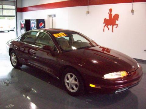 Dark Toreador Red Metallic Oldsmobile Aurora .  Click to enlarge.