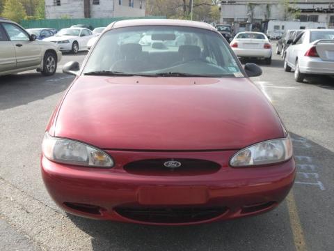 Toreador Red Metallic Ford Escort LX Sedan.  Click to enlarge.