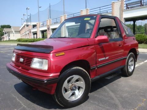 Brilliant Red Metallic Geo Tracker LSi Soft Top 4x4.  Click to enlarge.