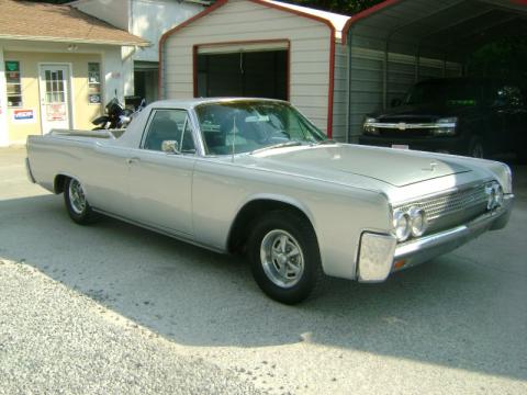 Silver Lincoln Continental Custom Funeral Flower Car.  Click to enlarge.