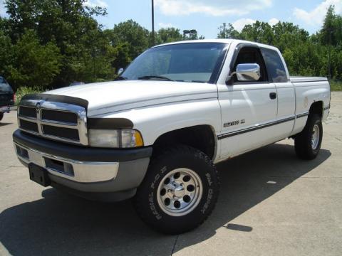 Bright White Dodge Ram 1500 Laramie SLT Extended Cab 4x4.  Click to enlarge.