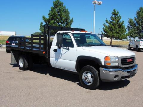 Summit White GMC Sierra 3500HD SLE Crew Cab 4x4 Dually Flat Bed.  Click to enlarge.