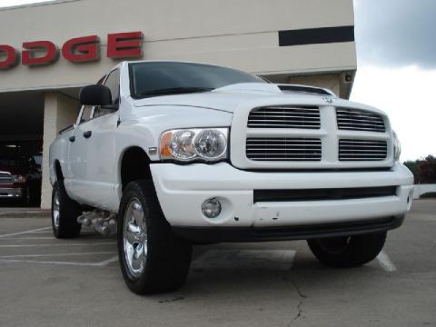 Bright White Dodge Ram 1500 SLT Quad Cab 4x4.  Click to enlarge.