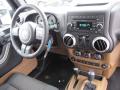 Dashboard of 2011 Jeep Wrangler Sahara 4x4 #10