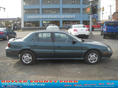 Medium Green-Blue Metallic Pontiac Grand Am SE Sedan.  Click to enlarge.