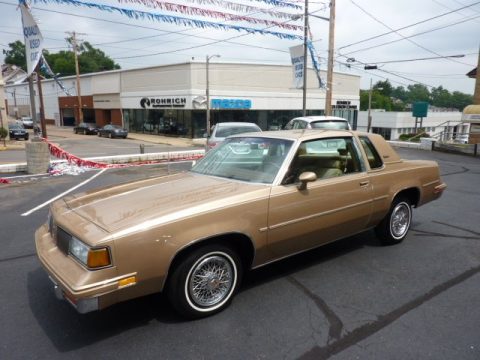 Sungold Metallic Oldsmobile Cutlass Supreme Coupe.  Click to enlarge.