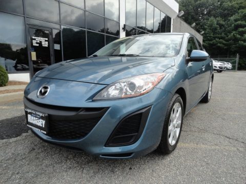 Gunmetal Blue Mica Mazda MAZDA3 i Touring 4 Door.  Click to enlarge.