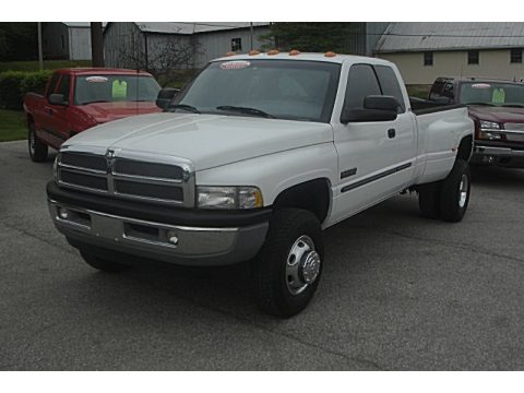 Bright White Dodge Ram 3500 SLT Quad Cab 4x4 Dually.  Click to enlarge.