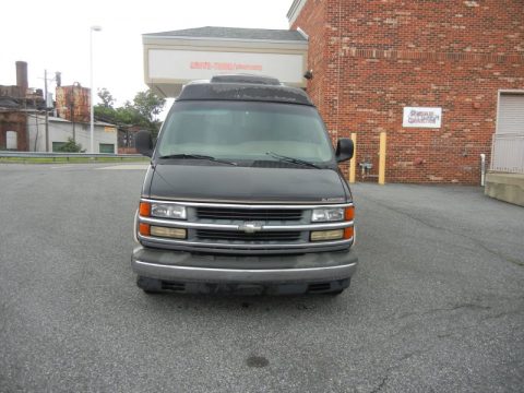 Black Chevrolet Express 1500 Passenger Conversion Van.  Click to enlarge.