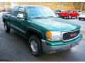 Front 3/4 View of 1999 GMC Sierra 1500 SLE Extended Cab 4x4 #8