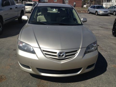 Shimmering Sand Metallic Mazda MAZDA3 i Sedan.  Click to enlarge.