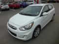Front 3/4 View of 2012 Hyundai Accent SE 5 Door #3