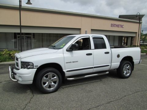 Bright White Dodge Ram 1500 Laramie Quad Cab 4x4.  Click to enlarge.