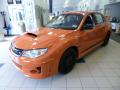 Front 3/4 View of 2013 Subaru Impreza WRX STi 4 Door Orange Special Edition #3