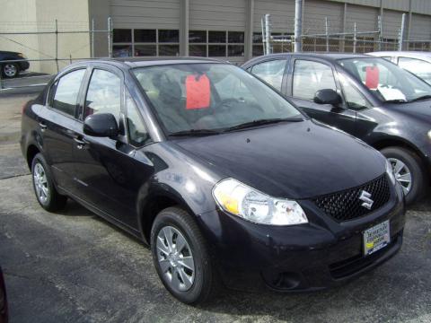 Black Pearl Metallic 2009 Suzuki SX4 Sedan LE with Beige interior Black 