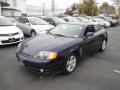 Front 3/4 View of 2004 Hyundai Tiburon  #3