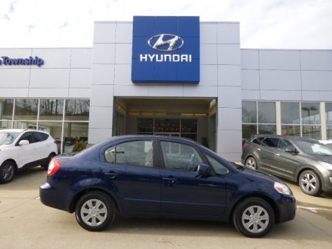 Deep Sea Blue Metallic Suzuki SX4 Sedan.  Click to enlarge.