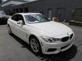 Front 3/4 View of 2014 BMW 4 Series 428i xDrive Coupe #7